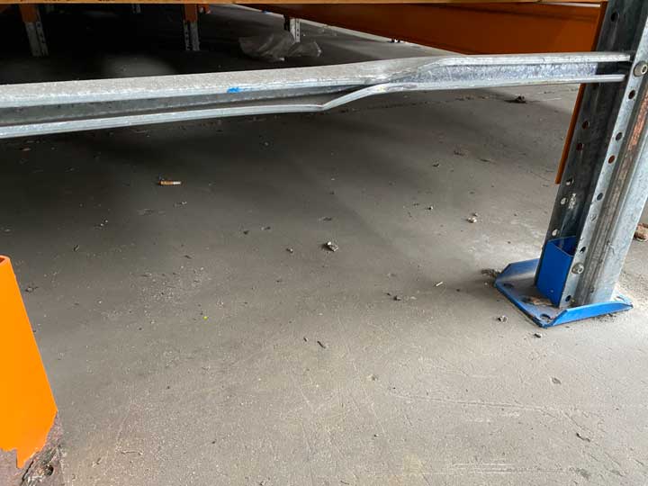 Overloaded pallet rack in warehouse