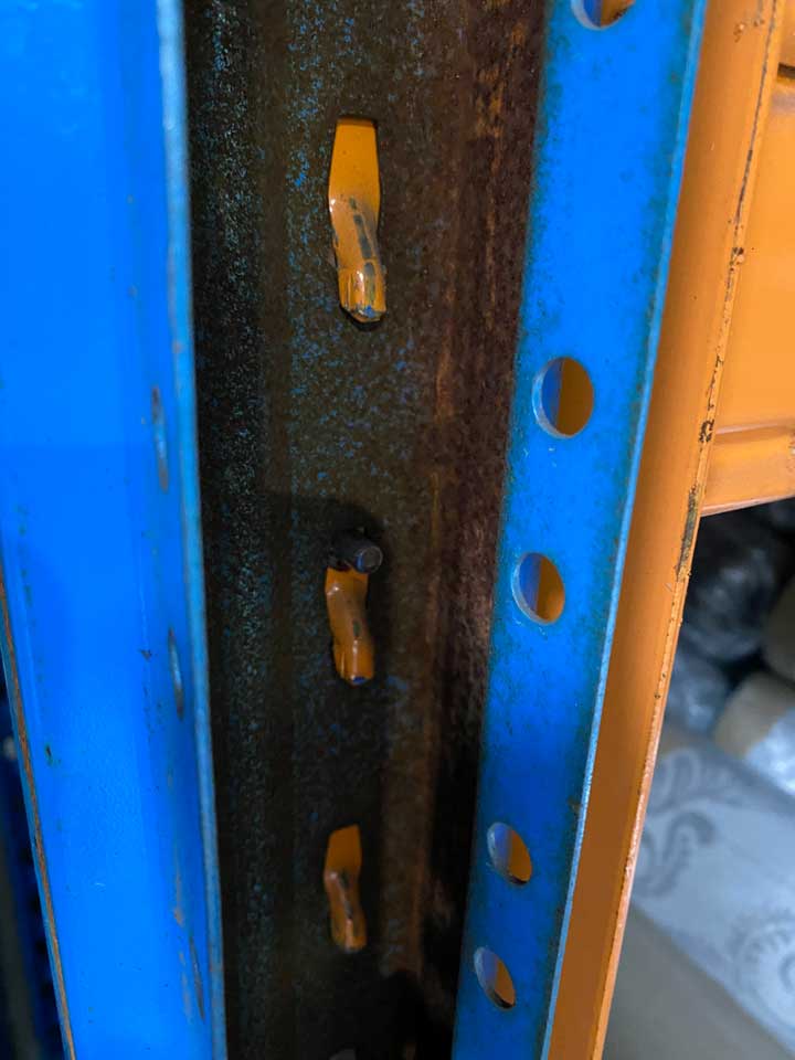 Cracked or rusted beams in warehouse racking